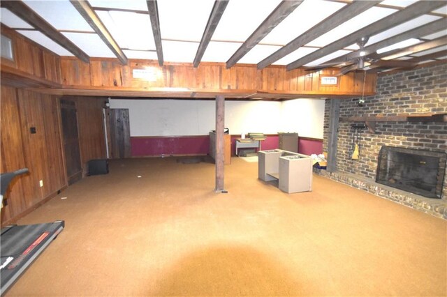 corridor featuring coffered ceiling, dark wood-style floors, a wainscoted wall, beamed ceiling, and wood walls