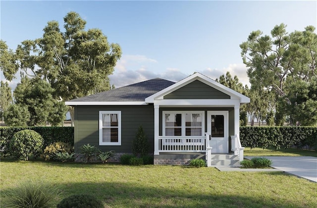 view of front of property with a porch, a front lawn, and fence