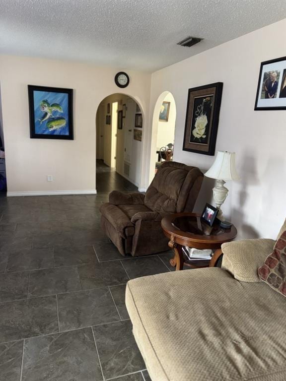 living room featuring a textured ceiling