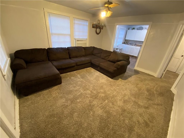 living room with carpet floors and ceiling fan