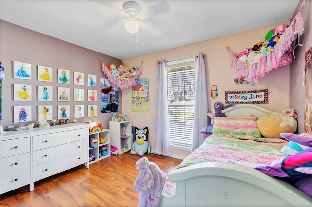 bedroom with light wood-type flooring and a ceiling fan