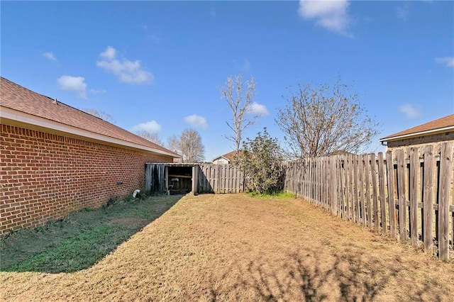 view of yard with a fenced backyard