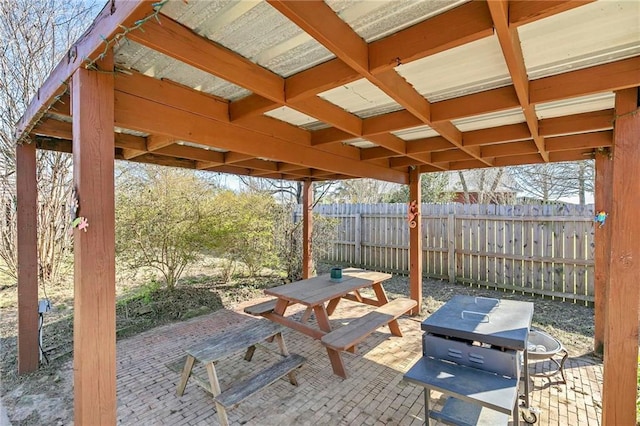 view of patio featuring fence