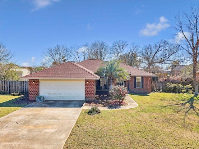 view of front of house featuring a front yard, concrete driveway, brick siding, and fence