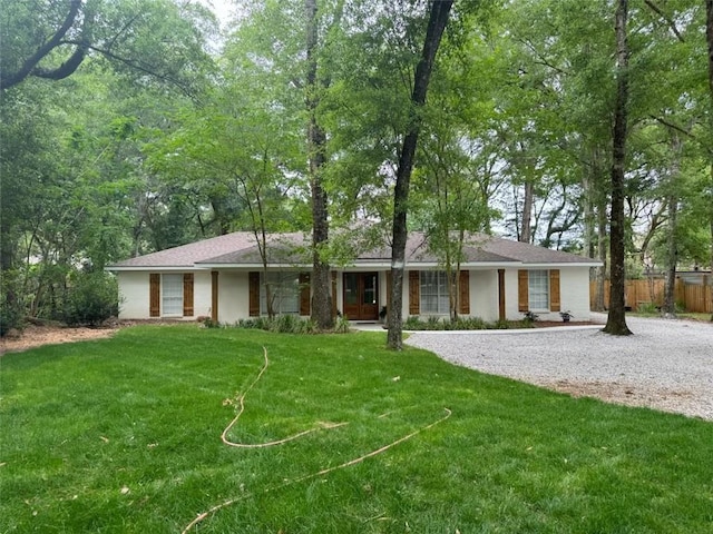 ranch-style house with a front yard