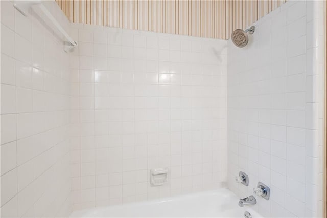 bathroom with shower / bath combination and wallpapered walls