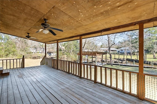 wooden terrace featuring a ceiling fan