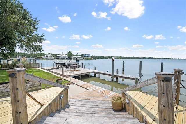 view of dock featuring a water view and boat lift