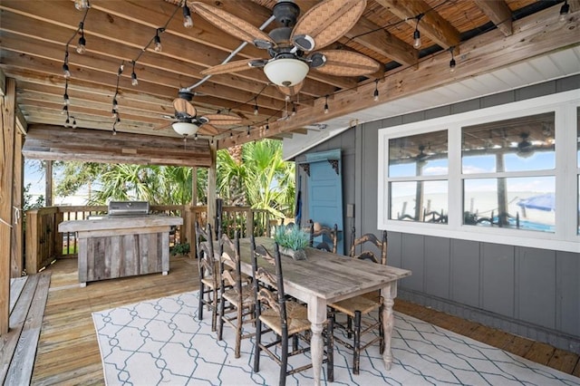 view of patio / terrace featuring a ceiling fan, outdoor dining space, a deck, and grilling area