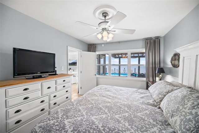 bedroom featuring ceiling fan and light tile patterned flooring