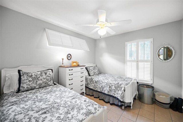 bedroom featuring ceiling fan and light tile patterned floors