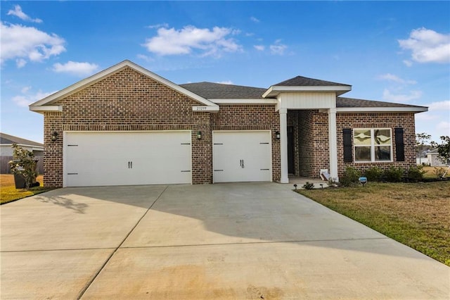 view of front facade featuring an attached garage, brick siding, driveway, roof with shingles, and a front lawn