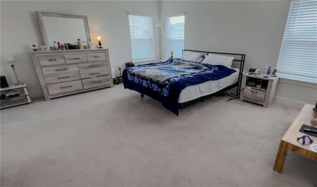 bedroom with light colored carpet