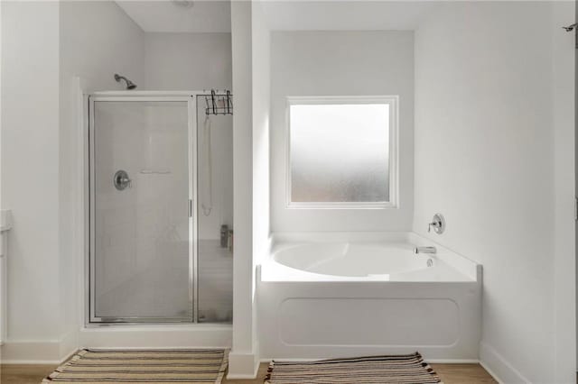 bathroom with vanity, wood-type flooring, and independent shower and bath