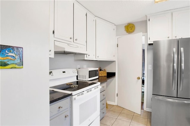 kitchen with white appliances, white cabinets, under cabinet range hood, and light tile patterned floors