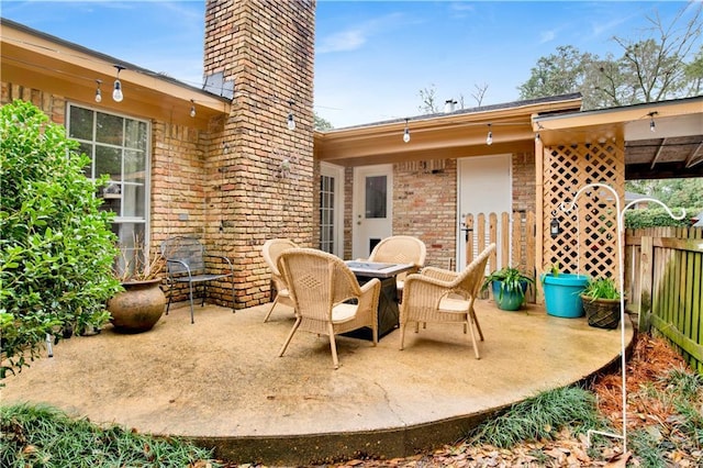 view of patio featuring fence