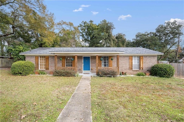 ranch-style house with a front lawn