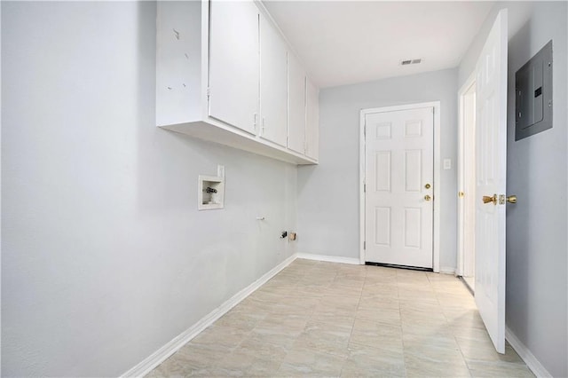 laundry area featuring washer hookup, cabinets, and electric panel