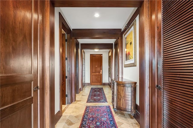 18269 Colony Dr Unit 405, Fairhope, AL 36532 - corridor featuring stone tile floors, baseboards, and wood walls