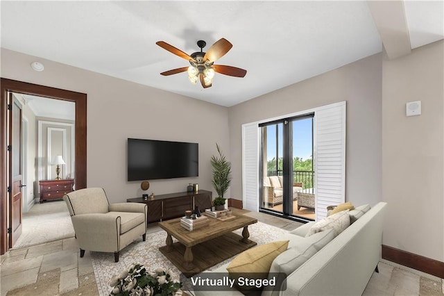 18269 Colony Dr Unit 405, Fairhope, AL 36532 - living room with a ceiling fan, stone tile floors, and baseboards