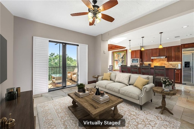 18269 Colony Dr Unit 405, Fairhope, AL 36532 - living area featuring stone tile flooring, ceiling fan, recessed lighting, and baseboards