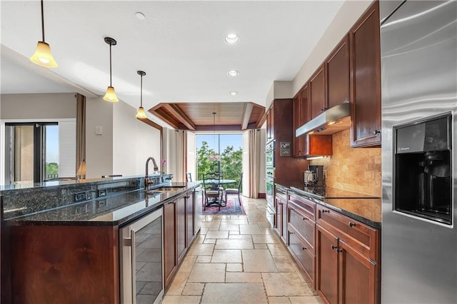 18269 Colony Dr Unit 405, Fairhope, AL 36532 - kitchen with stainless steel appliances, beverage cooler, under cabinet range hood, stone tile flooring, and a sink