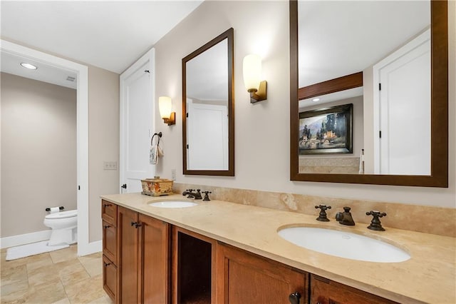 18269 Colony Dr Unit 405, Fairhope, AL 36532 - bathroom with double vanity, a bidet, baseboards, toilet, and recessed lighting