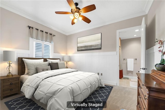 18269 Colony Dr Unit 405, Fairhope, AL 36532 - bedroom with wainscoting, ornamental molding, and a ceiling fan