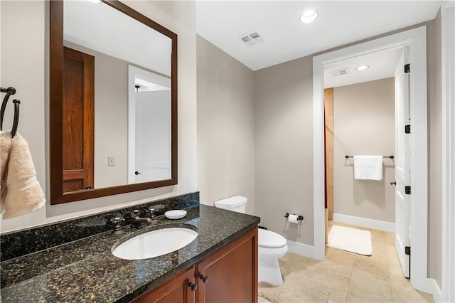 18269 Colony Dr Unit 405, Fairhope, AL 36532 - bathroom featuring toilet, vanity, baseboards, recessed lighting, and tile patterned flooring