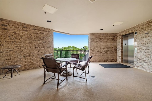 18269 Colony Dr Unit 405, Fairhope, AL 36532 - view of patio with elevator and a balcony
