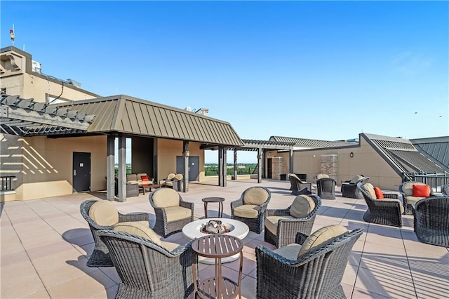 18269 Colony Dr Unit 405, Fairhope, AL 36532 - view of patio / terrace featuring an outdoor living space with a fire pit and a pergola