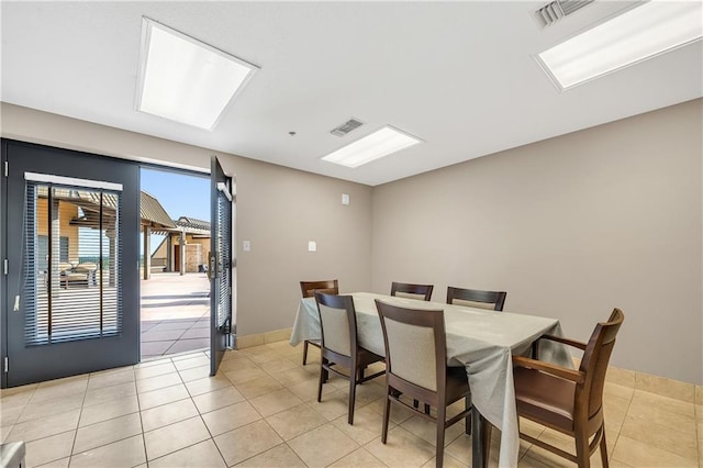 18269 Colony Dr Unit 405, Fairhope, AL 36532 - dining room with light tile patterned floors and baseboards