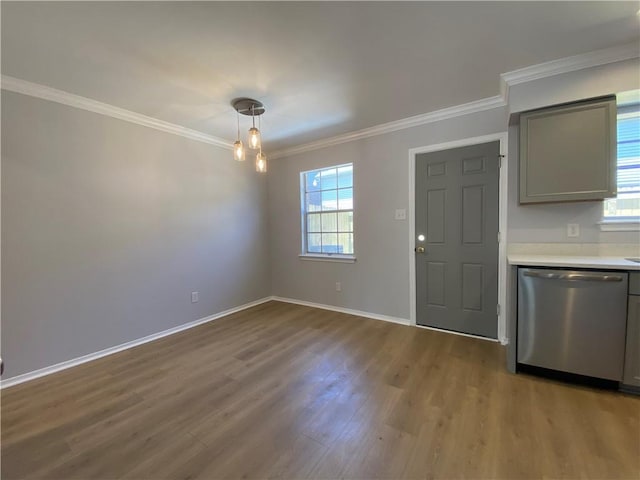 112 Du Rhu Dr Unit 112-H, Mobile, AL 36608 - unfurnished dining area featuring plenty of natural light, wood finished floors, crown molding, and baseboards