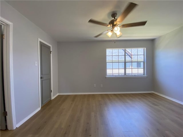 112 Du Rhu Dr Unit 112-H, Mobile, AL 36608 - empty room featuring wood finished floors, a ceiling fan, and baseboards