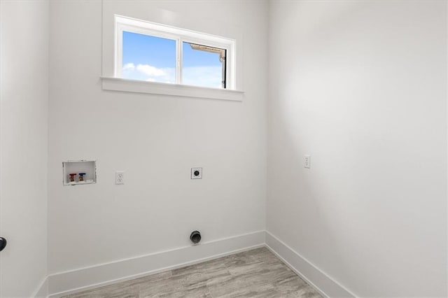 washroom featuring washer hookup, electric dryer hookup, and light wood-type flooring