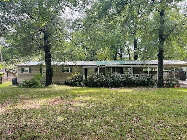 exterior space with a front lawn and cooling unit