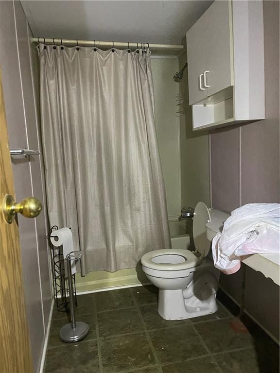 bathroom featuring toilet, shower / bathtub combination with curtain, and tile patterned floors