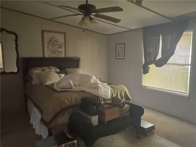 bedroom with ceiling fan and carpet