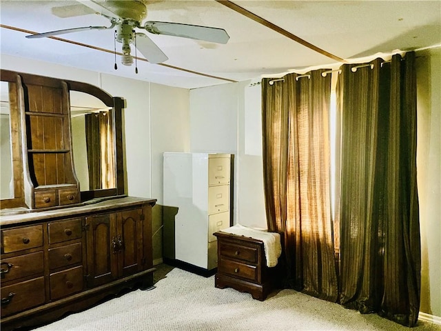 bedroom with light colored carpet and ceiling fan