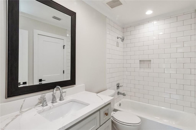 full bathroom with shower / washtub combination, visible vents, vanity, and toilet