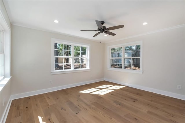 empty room featuring baseboards, ceiling fan, ornamental molding, wood finished floors, and recessed lighting