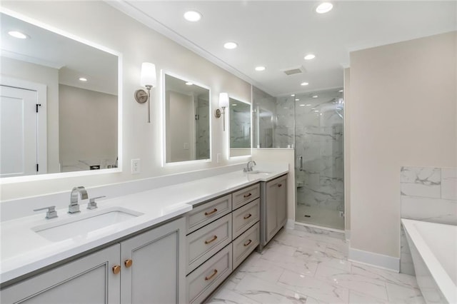 full bath featuring marble finish floor, a marble finish shower, a sink, and recessed lighting