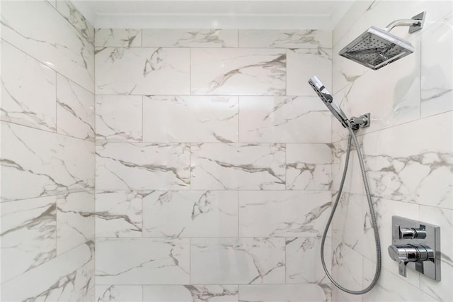 details featuring crown molding and tiled shower