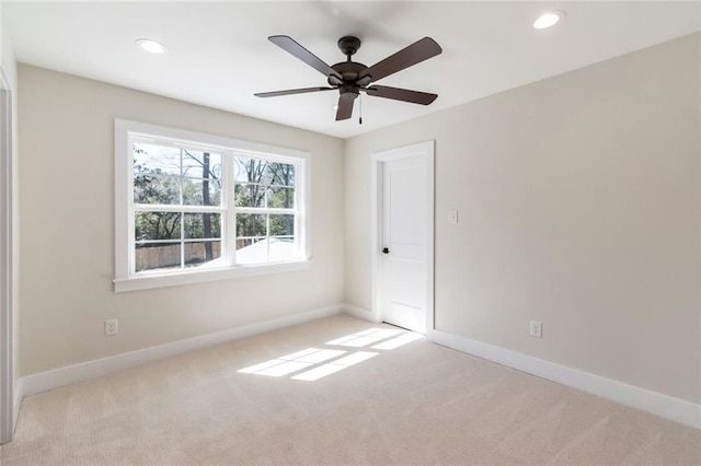 carpeted spare room with ceiling fan, recessed lighting, and baseboards