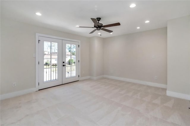 unfurnished room with recessed lighting, light colored carpet, a ceiling fan, baseboards, and french doors