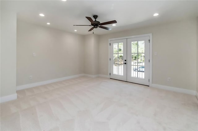 carpeted empty room with recessed lighting, baseboards, ceiling fan, and french doors