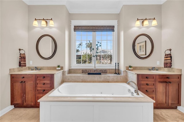 bathroom featuring crown molding, a tub with jets, and a sink