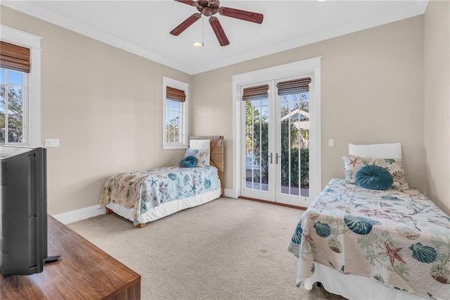 carpeted bedroom featuring baseboards, ceiling fan, ornamental molding, access to exterior, and french doors