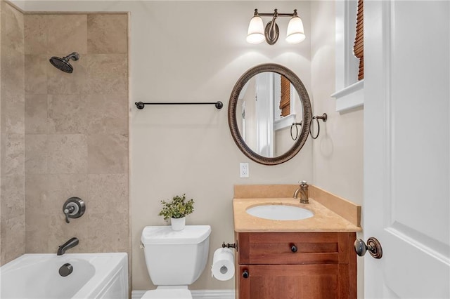 full bathroom featuring bathtub / shower combination, vanity, and toilet