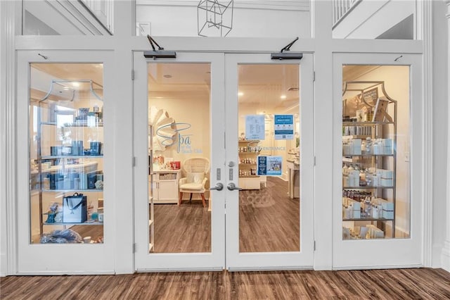 entryway with french doors and wood finished floors